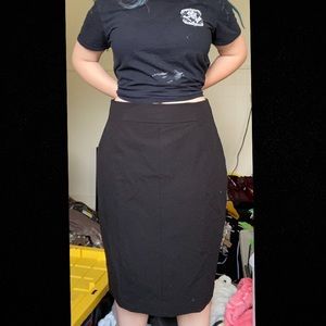 Modest length black skirt